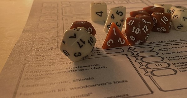 5th edition dungeons & dragons character sheet and dice