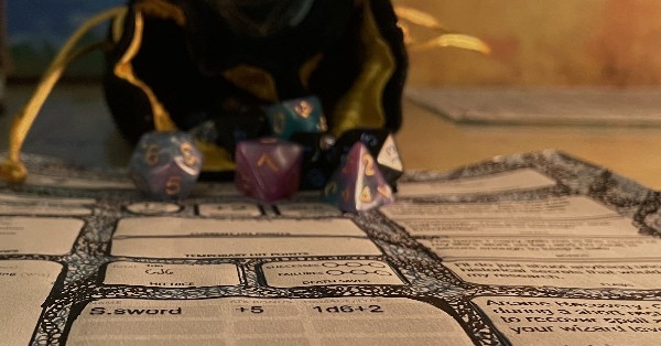 dungeons and dragons character sheet and dice bag